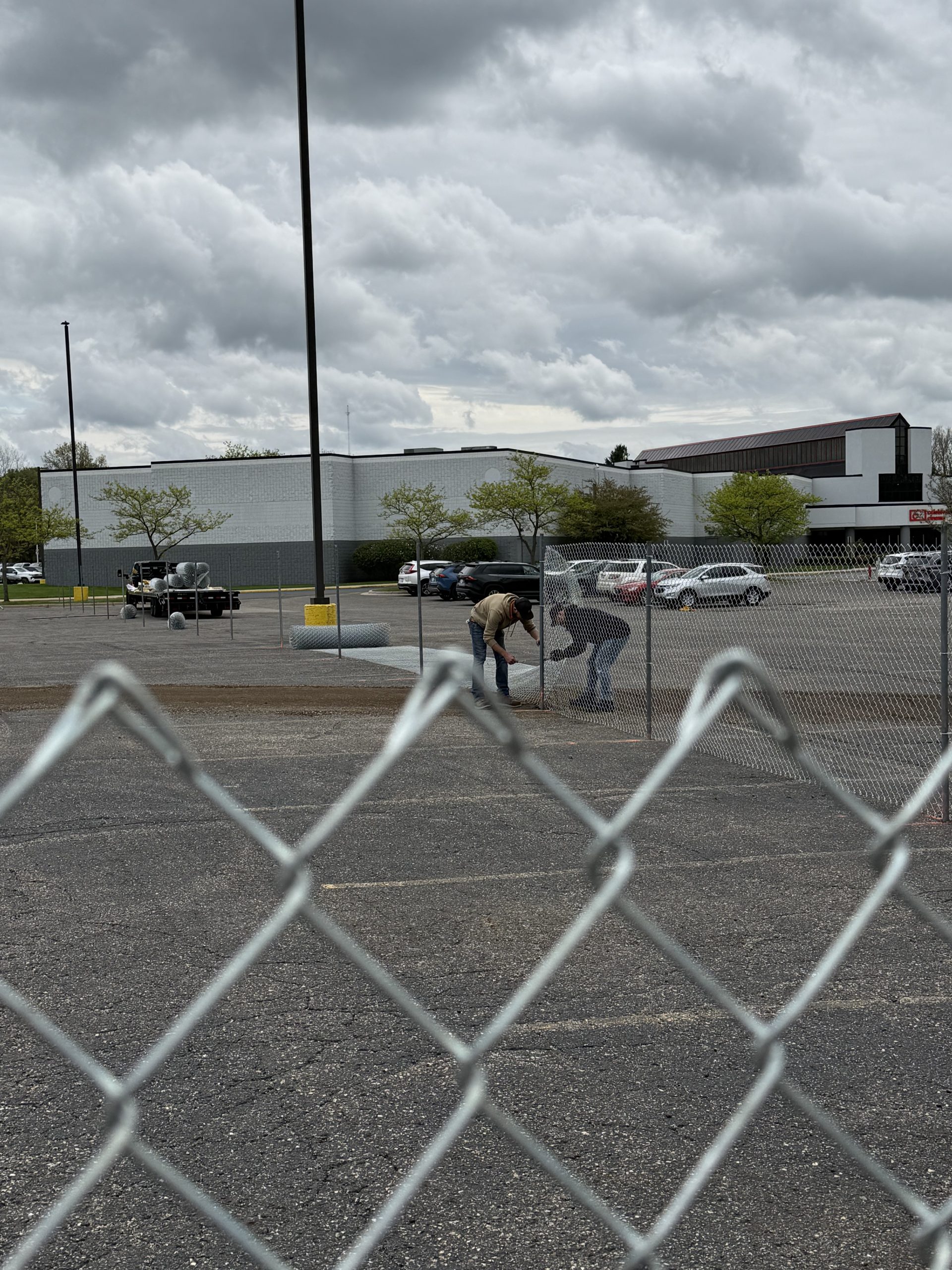 chain link fence in parking lot - during fencing