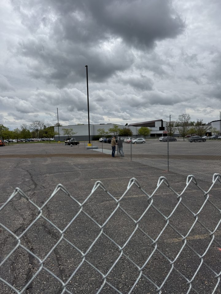 chain link fence in parking lot - during post