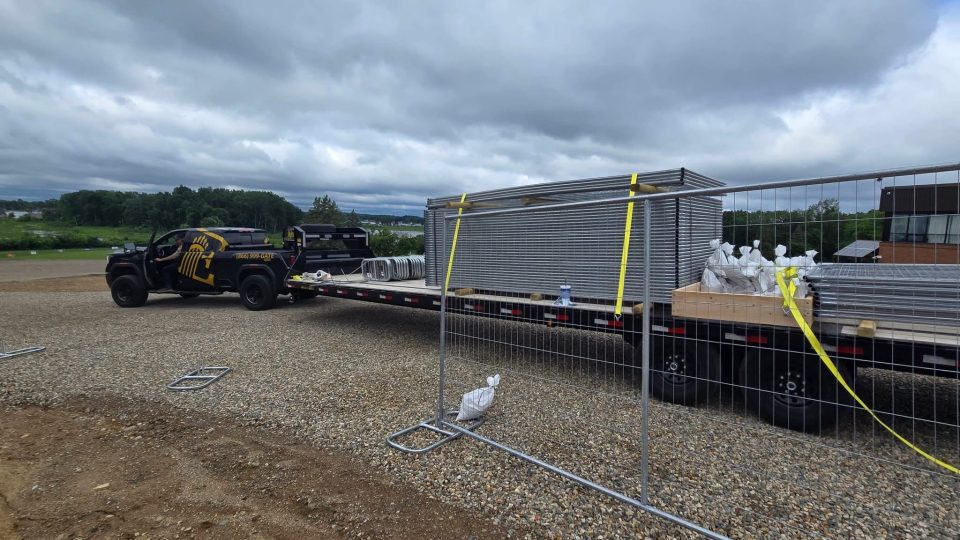 temporary fencing being installed